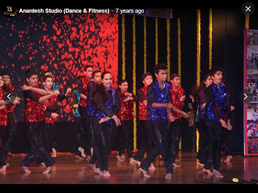 Bollywood and Western dance ensemble in sequinned costumes